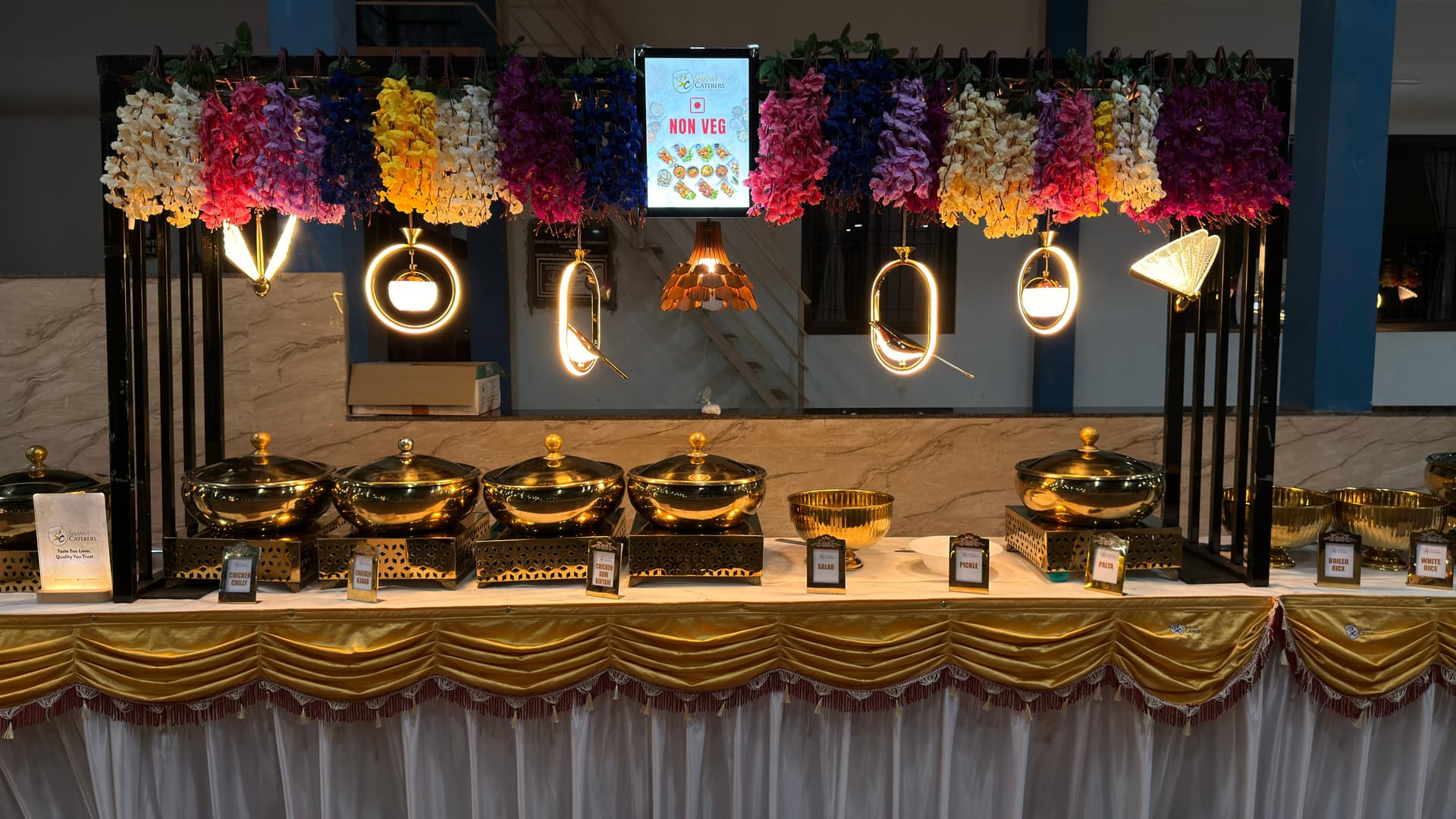 Shanvi Caterers premium outdoor buffet setup with fairy lights for weddings and events in Mangalore