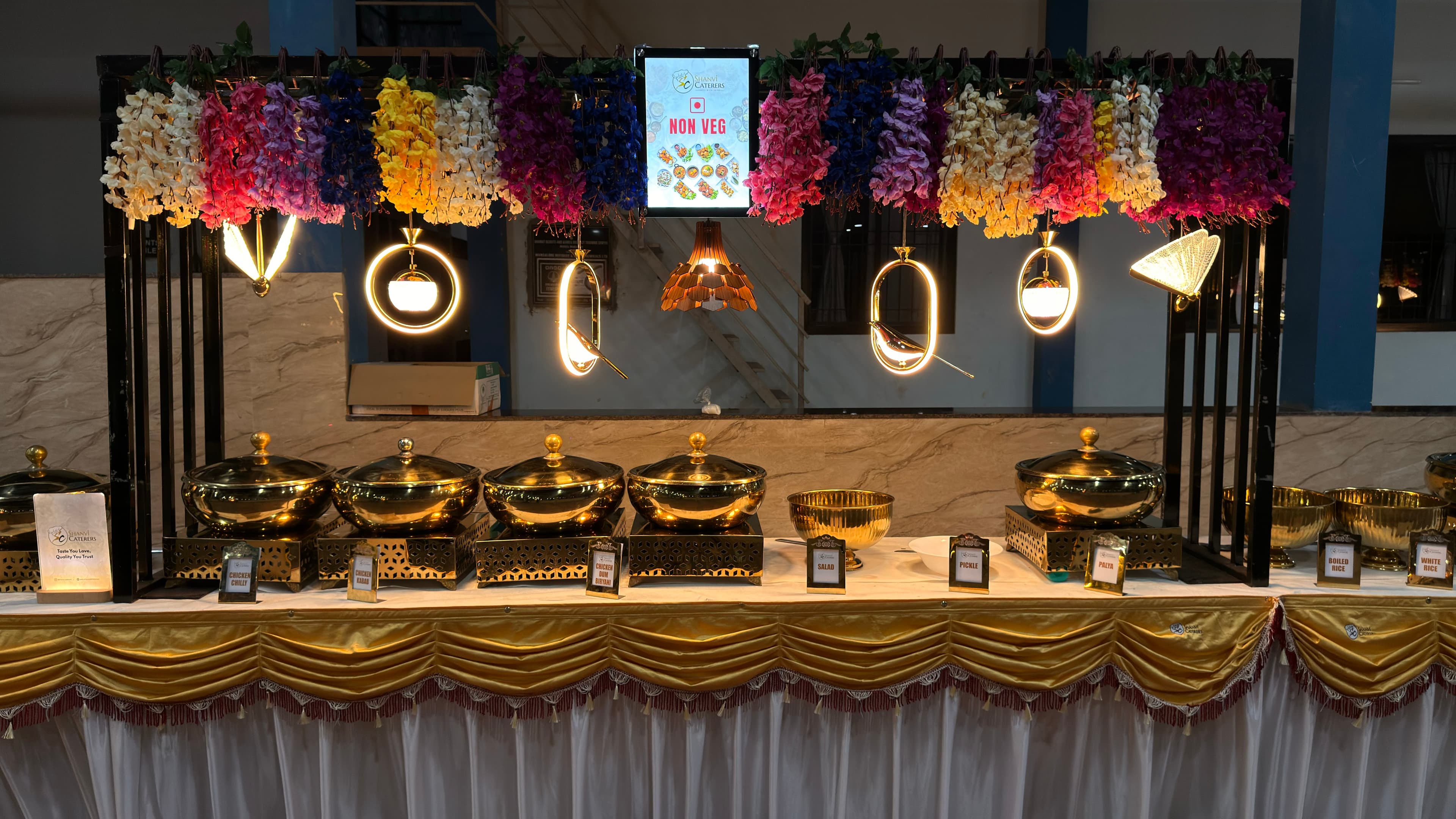 Shanvi Caterers premium outdoor buffet setup with fairy lights for weddings and events in Mangalore